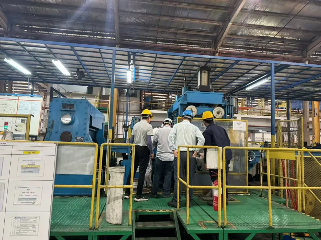 XIONGJIN engineers reviewing a steel coil processing line