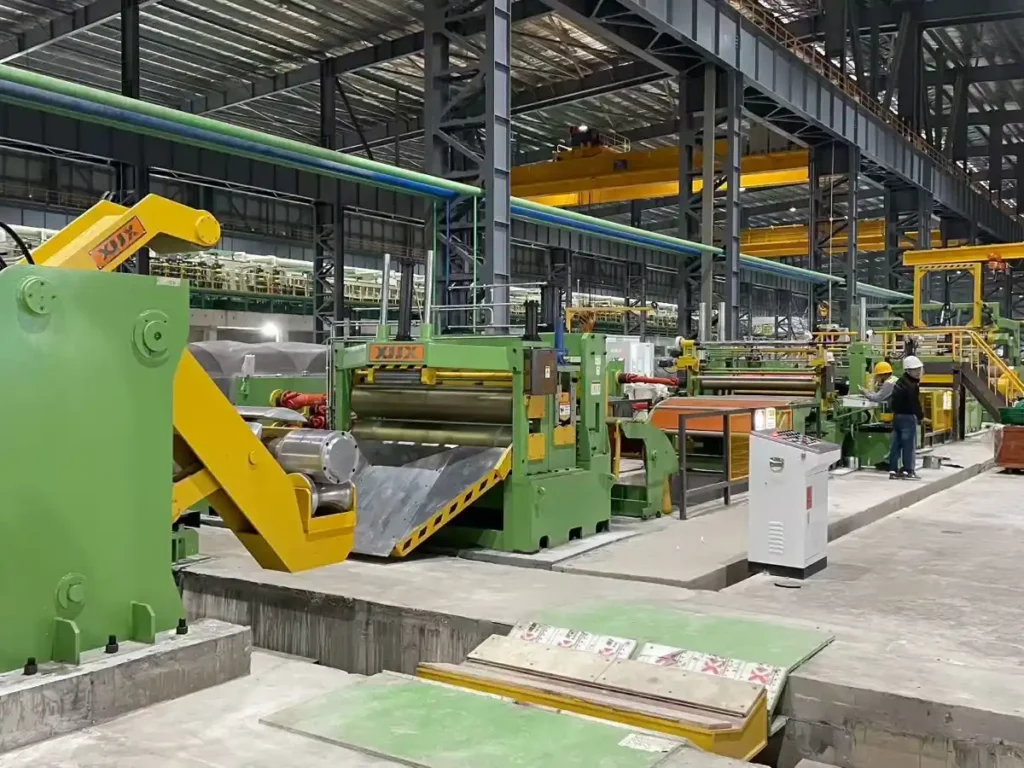 XIONGJIN technical team inspecting a steel coil processing line