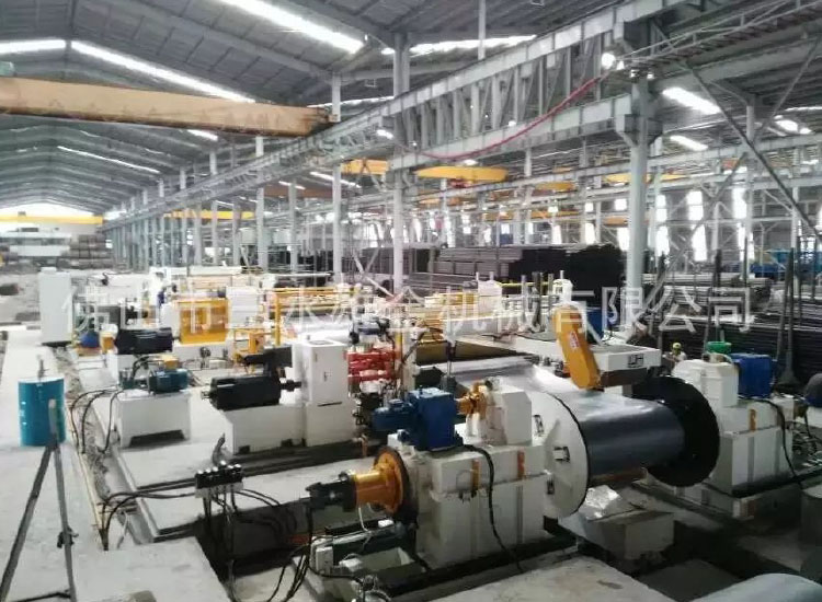Xiongjin Machinery Model Z-32-2000S heavy duty slitting line installed and operating in Indonesia.