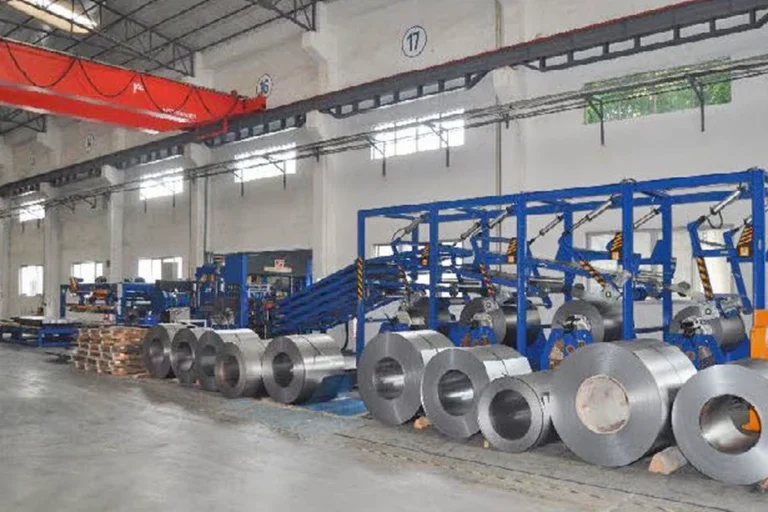 Steel coils stored beside an intelligent material storage system